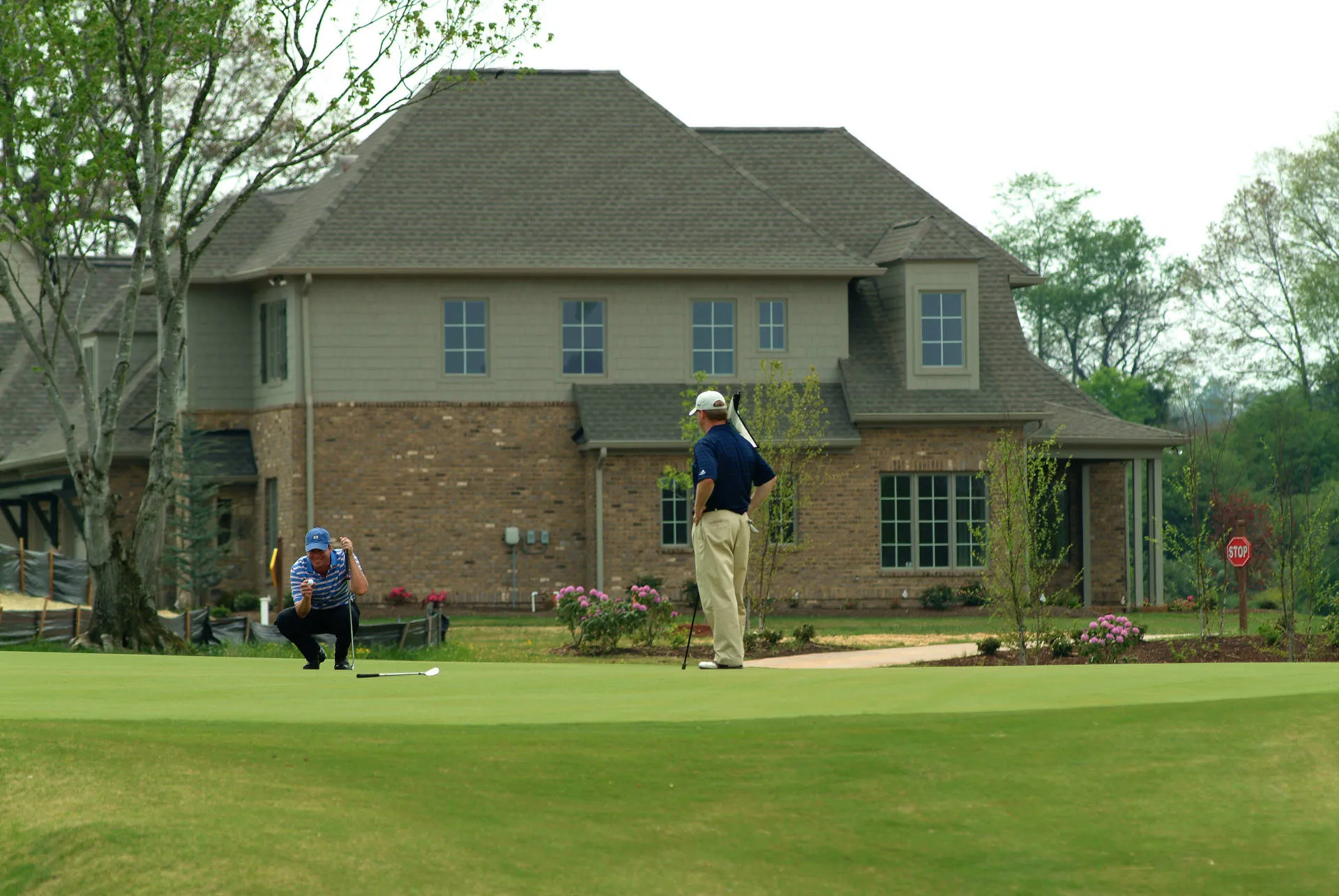 Golfers on the course at Tennessee National with mountain views